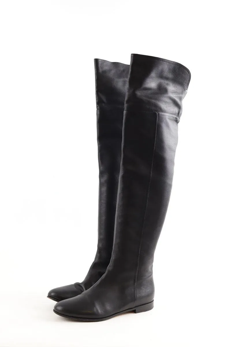 Bottes en cuir  Jimmy Choo noir. Matière principale cuir. Taille 38.